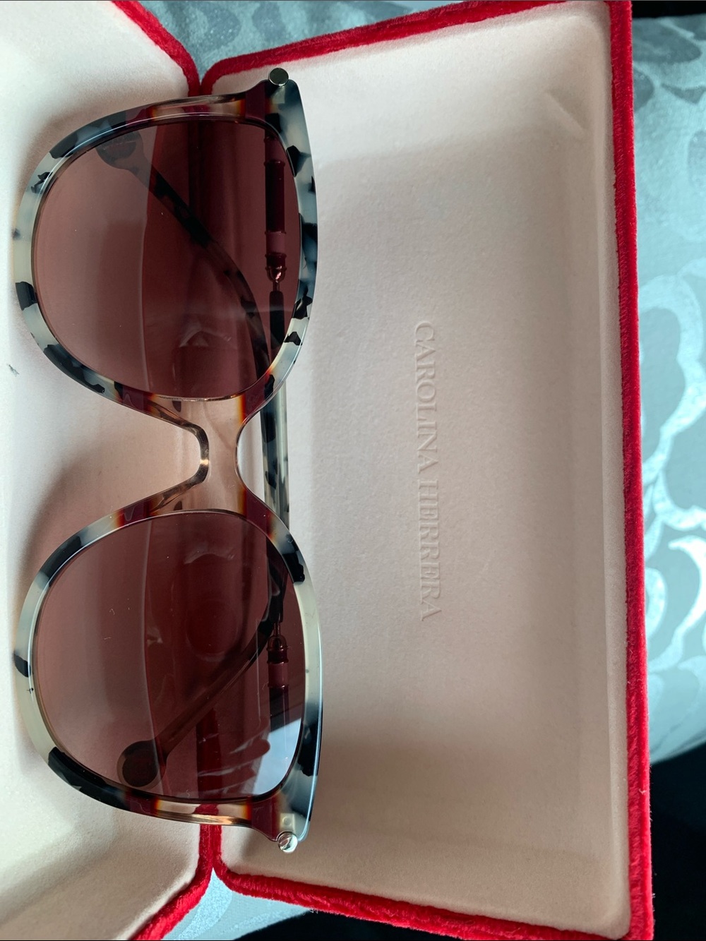 Carolina Herrera Tortoiseshell Frame Sunglasses with maroon Lenses